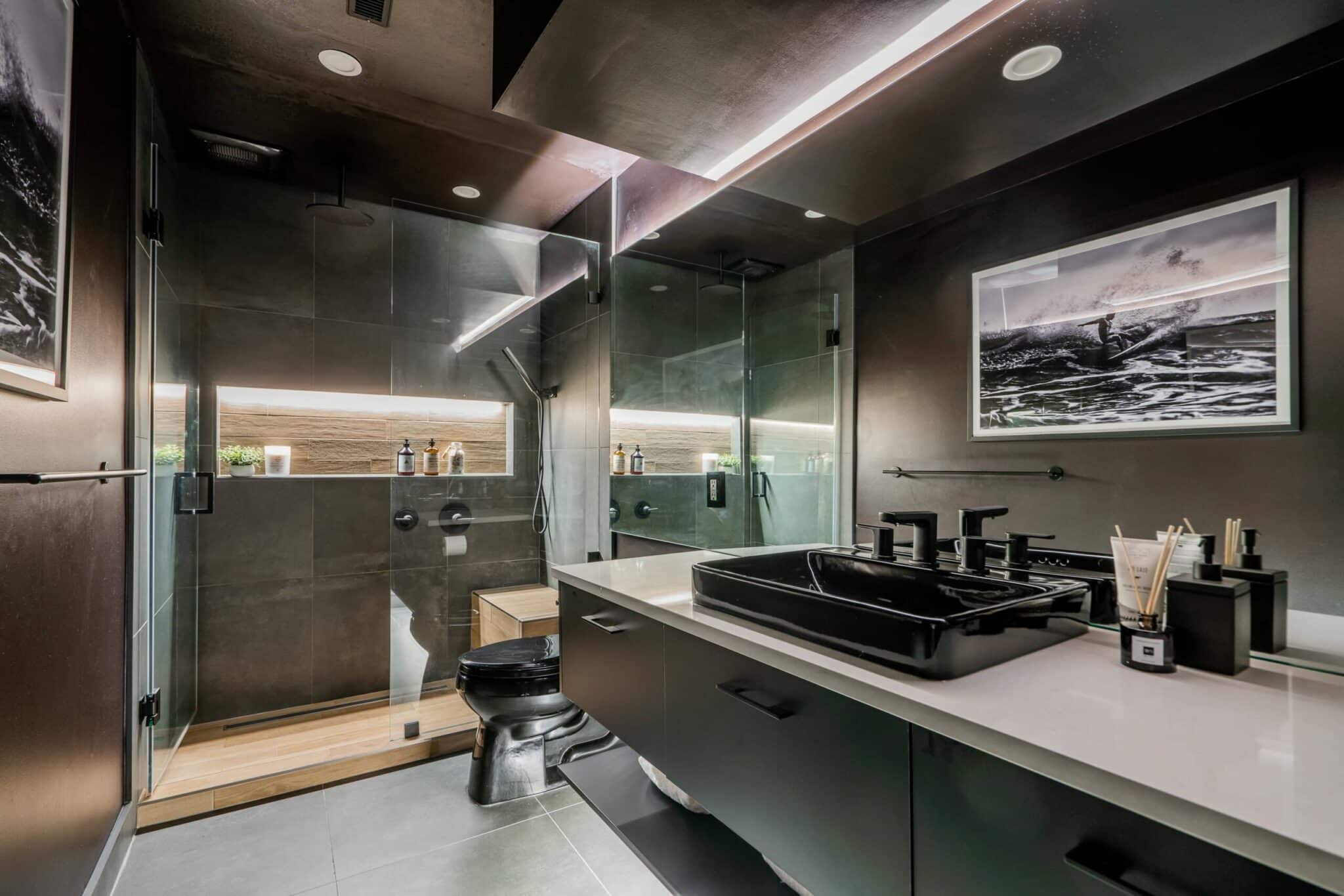 Luxury-bathroom-black-vanity-wood-tile-kohler-niche-spa-faucet