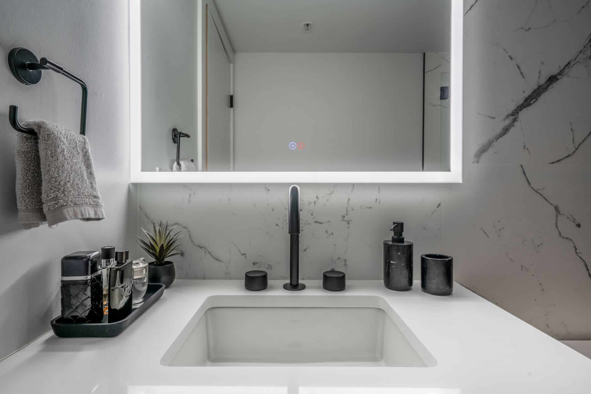 Vancouver-interior-design-bathroom-black-faucet-white-counter-marble-tile