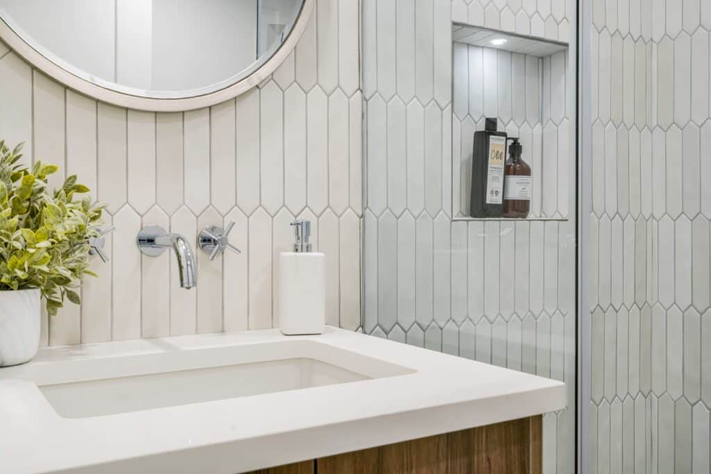 bathroom-niche-tile-renovation-modern-white-countertop-stainless-steel-niche-staging-unique