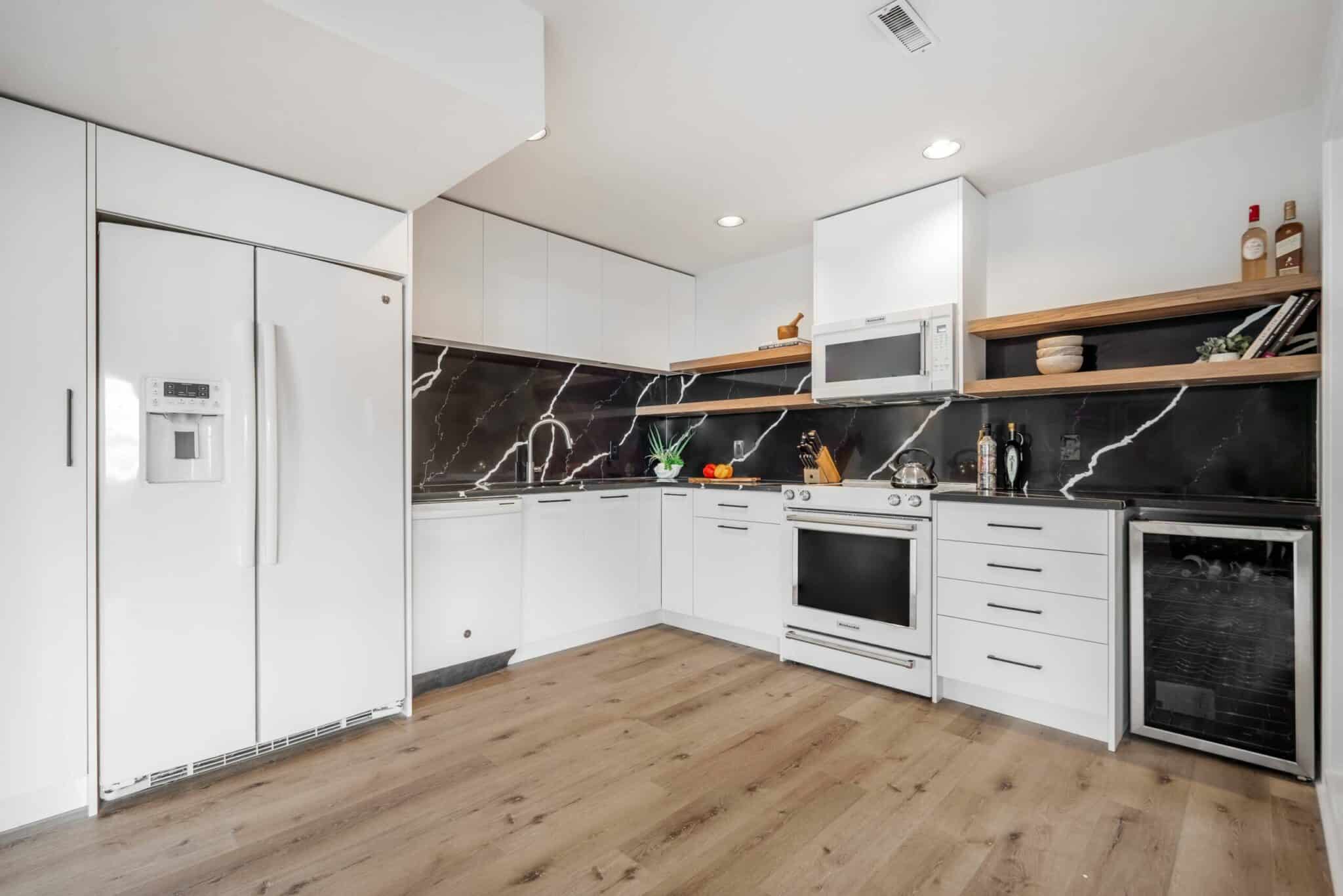 best-kitchen-renovation-basement-white-black-marble-bar-mancave