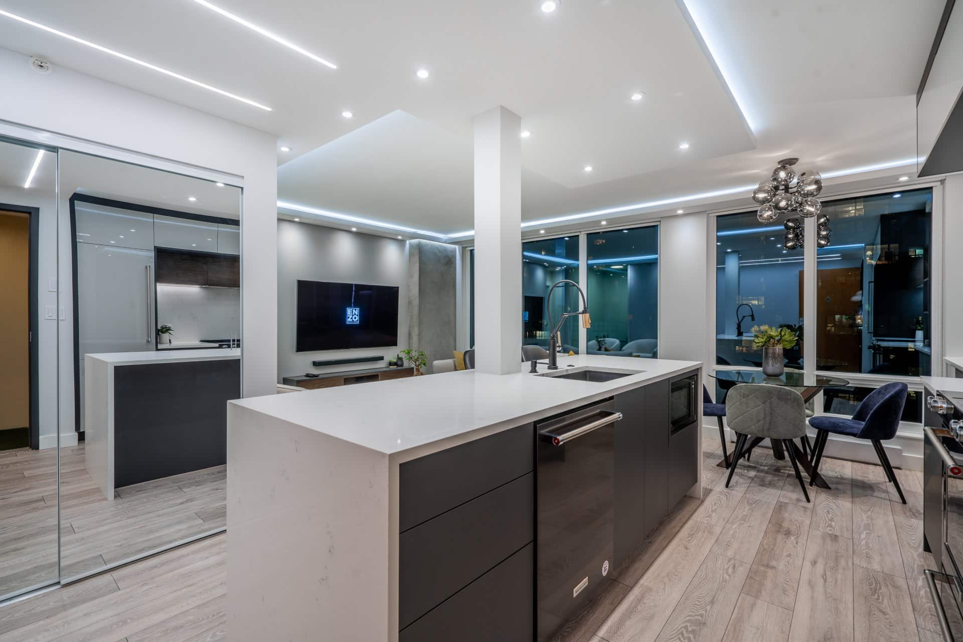 condo-renovation-open-concept-kitchen-ceiling-custom-lighting-dark-feature-cabinet