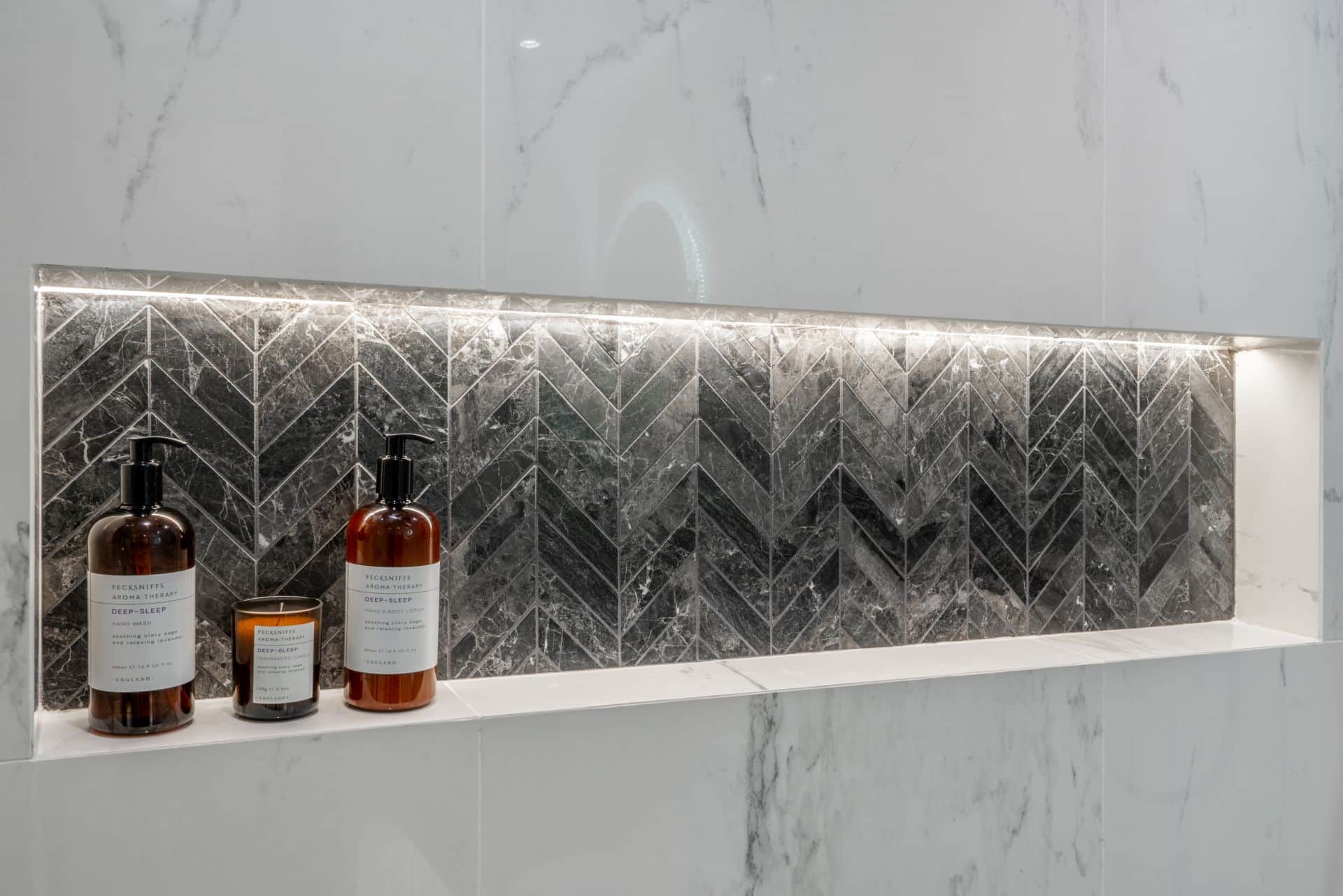 herringbone-black-marble-tile-niche-custom-shower