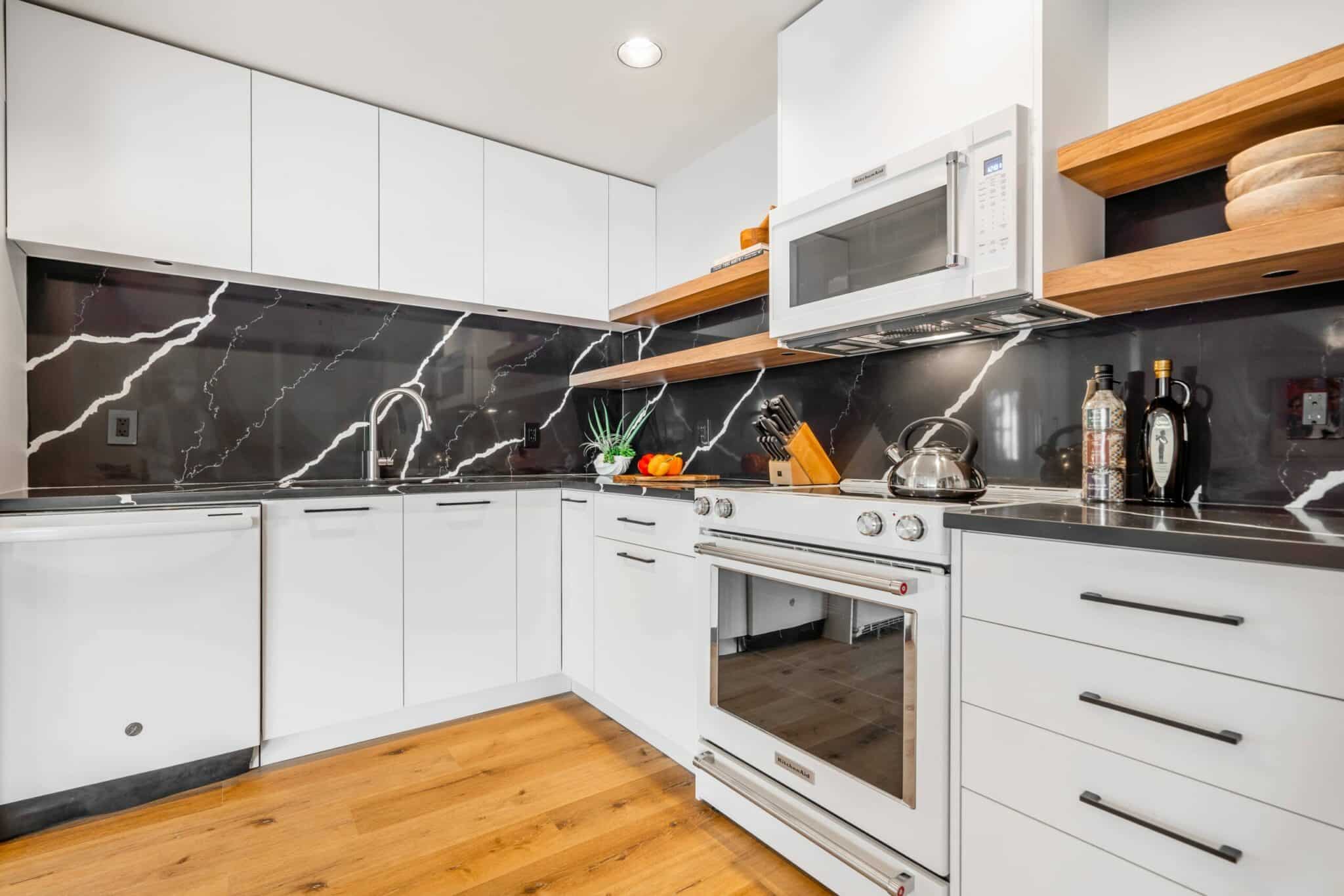 modern-kitchen-renovation-basement-white-cabinet-range-microwave