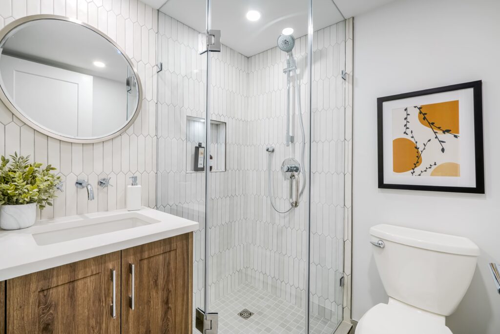 subway-tile-bathroom-vancouver-round-mirror-vanity-staging-renovation-unique-modern