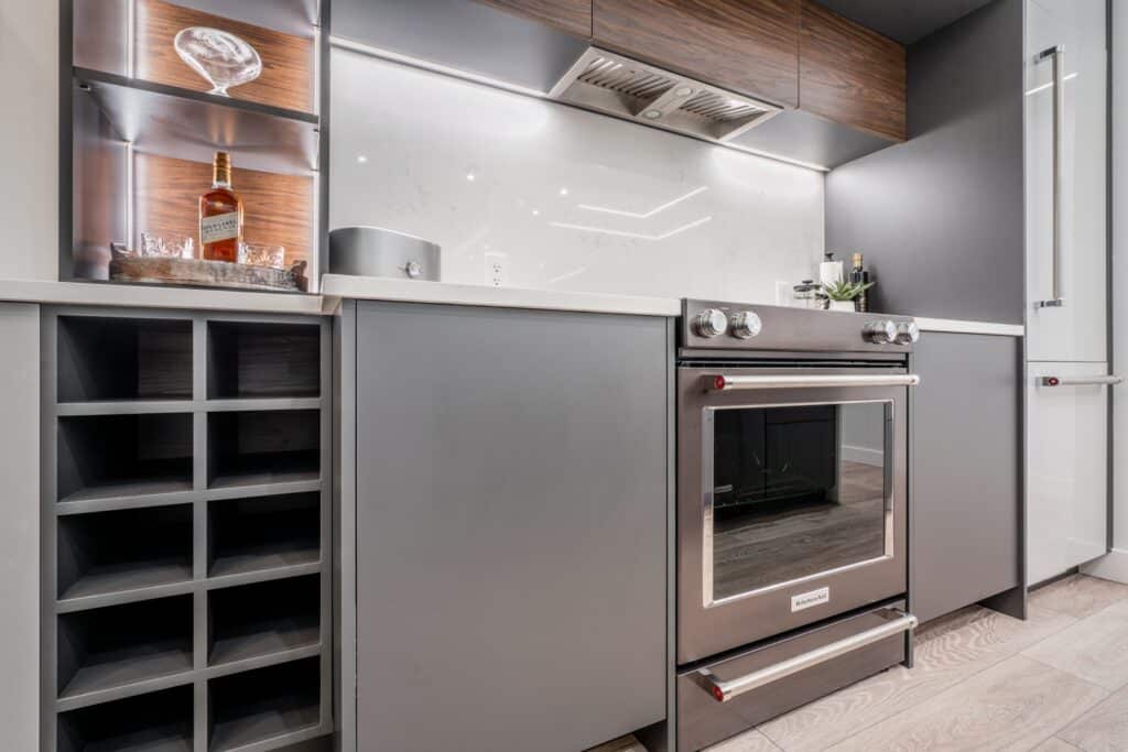vancouver-renovation-kitchen-aid-stove-dark-millwork-design