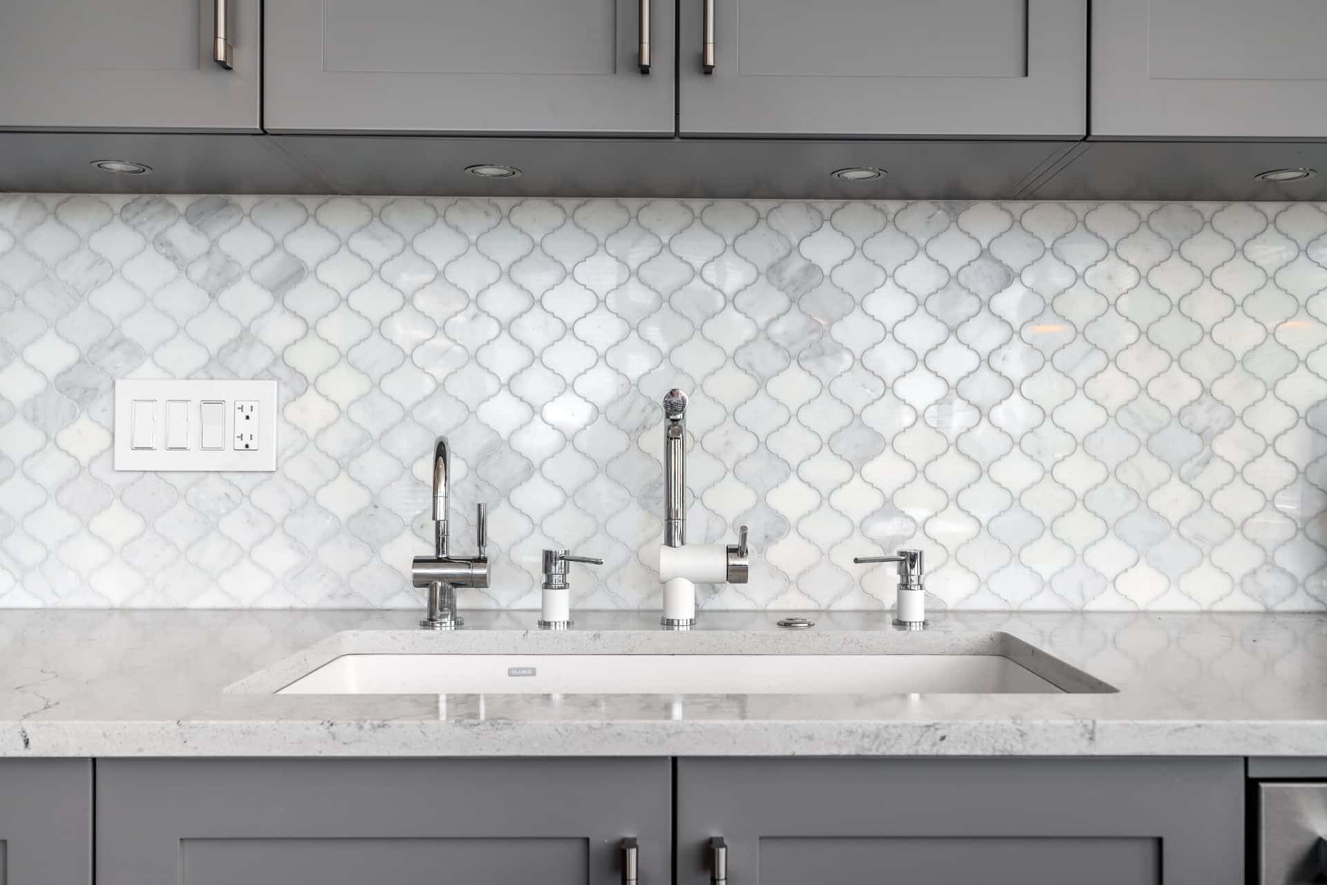 white-faucet-sink-real-marble-backsplash-kitchen-renovation