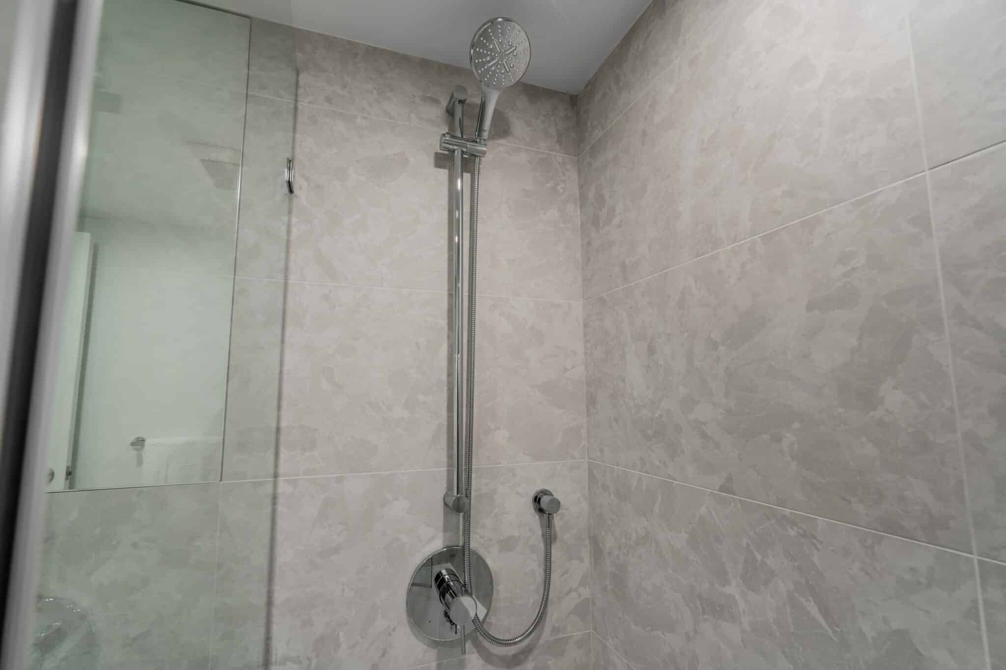 modern-luxury-condo-renovation-vancouver-tile-bathroom-faucet-chrome