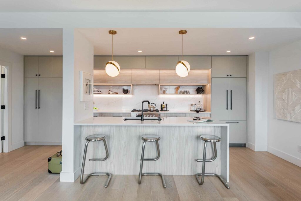 full-kitchen-renovation-vancouver-quartz-countertop-oak-custom-cabinets-bacl-fixtures-under-cabinet-light-stainless-steel-bar-stools